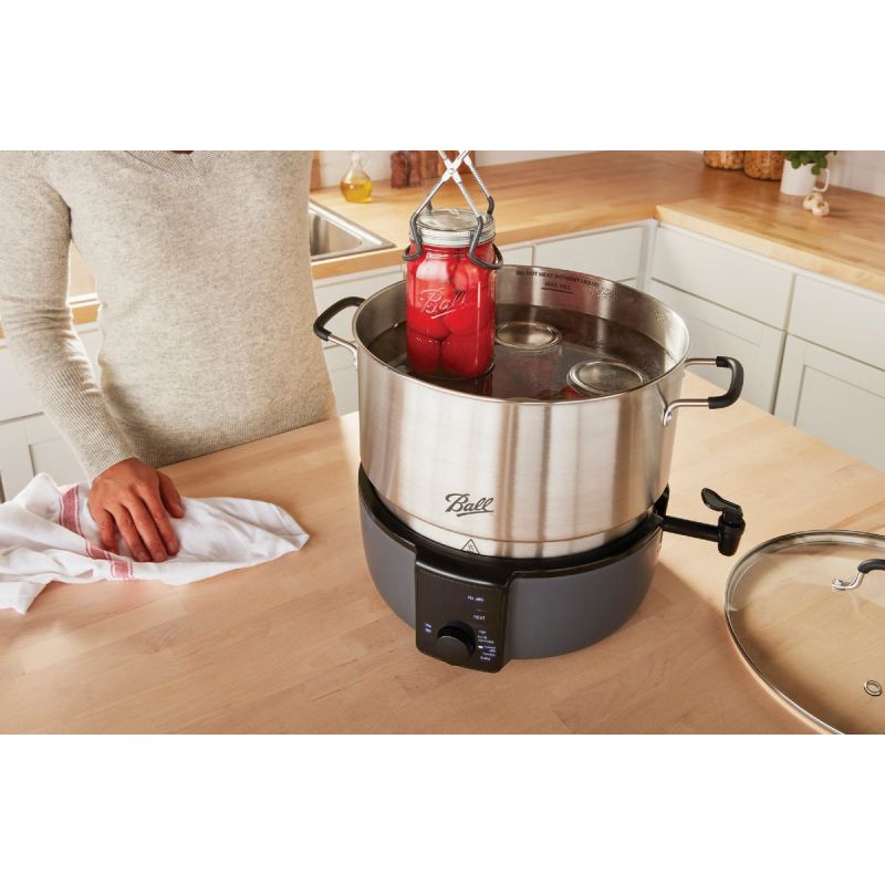 Electric water bath canner  Meet the electric water bath canner. I love  this tool. It has replaced my normal water bath canner because it frees up  my stovetop! I'll put the